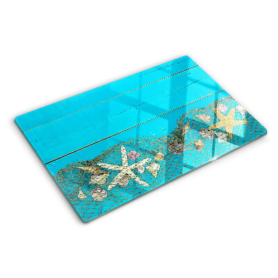 Planche à découper verre Coquillages et étoiles de mer dans un filet