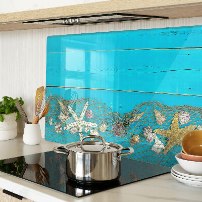 Planche à découper verre Coquillages et étoiles de mer dans un filet