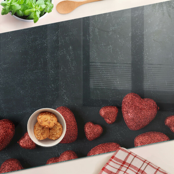 Planche à découper en verre Coeurs rouges sur fond sombre