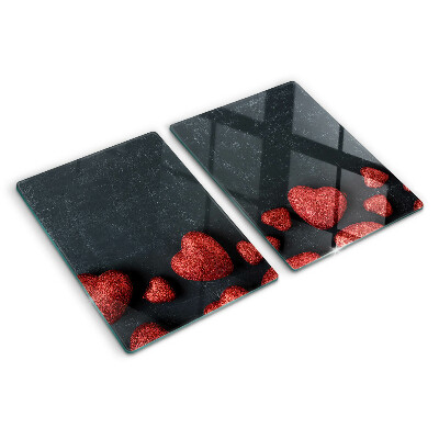 Planche à découper en verre Coeurs rouges sur fond sombre