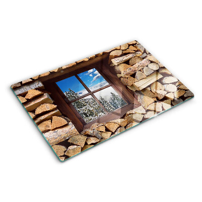 Planche à découper en verre Vue d'un paysage d'hiver à travers la fenêtre