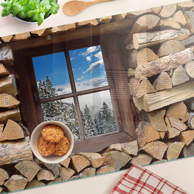 Planche à découper en verre Vue d'un paysage d'hiver à travers la fenêtre