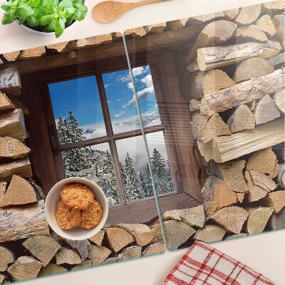 Planche à découper en verre Vue d'un paysage d'hiver à travers la fenêtre