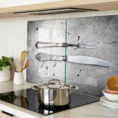 Planche à découper en verre Couverts sur fond de béton