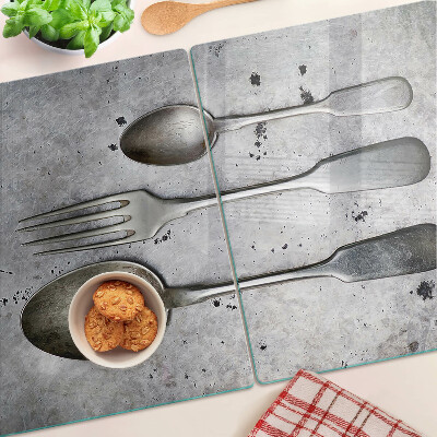 Planche à découper verre Couverts sur fond de béton
