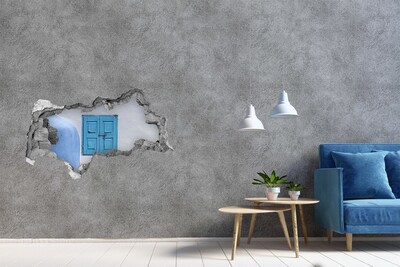 Sticker mural effet trou 3d Un mur délabré avec une porte bleue