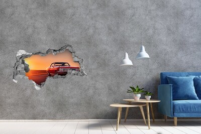 Autocollant mural trou Voiture classique sur fond de coucher de soleil
