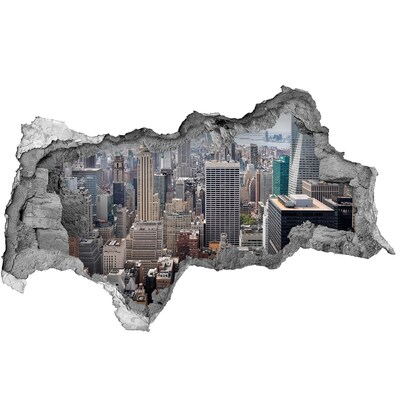 Sticker trou dans le mur Vue de la ville depuis un trou dans le mur