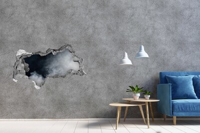 Sticker trou dans le mur Un mur brisé avec vue sur les nuages