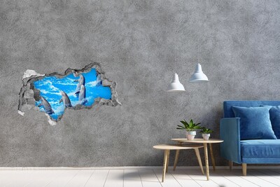 Autocollant mural trou Des dauphins qui sautent dans l'océan