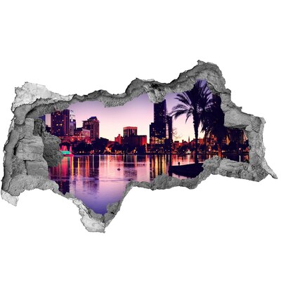 Sticker trou dans le mur Coucher de soleil sur la ville