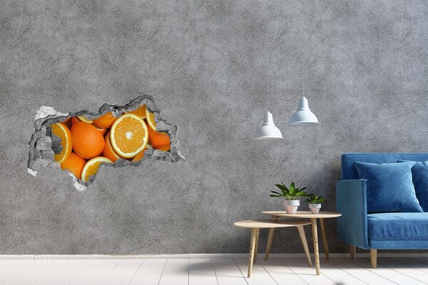 Autocollant mural trou Des oranges fraîches dans un trou dans le mur