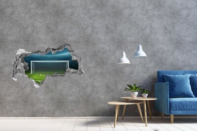 Sticker trou dans le mur Le stade de football derrière le trou dans le mur