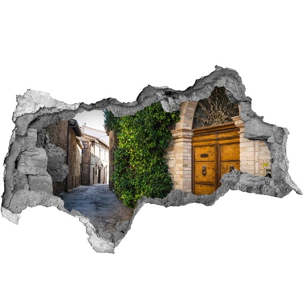 Sticker trou dans le mur Une ruelle charmante dans la ville