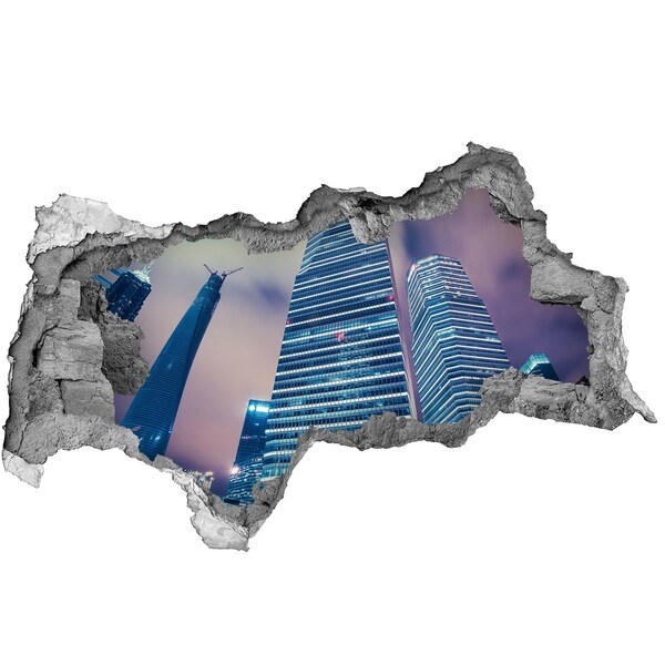 Sticker trou dans le mur Ville moderne à travers un trou dans le mur