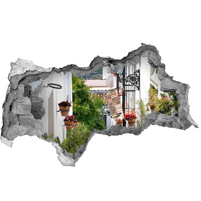 Sticker mural effet trou 3d Une rue charmante dans un village blanc