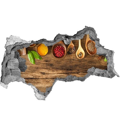 Sticker trou dans le mur Épices de cuisine sur un comptoir en bois