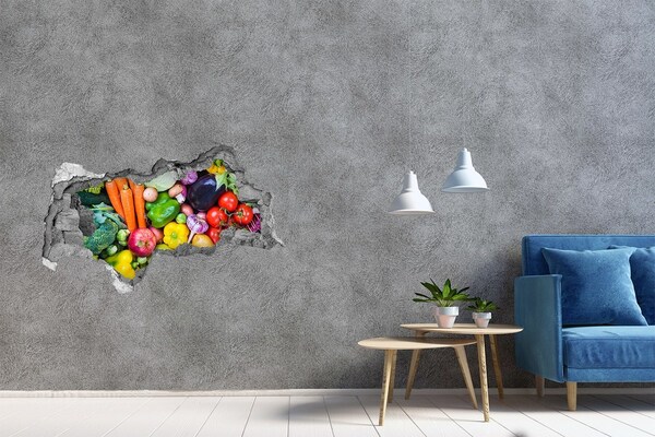 Sticker trou dans le mur Des légumes et des fruits colorés dans un trou dans le mur