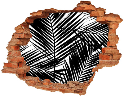 Sticker trou dans le mur Des feuilles tropicales dans un trou dans le mur