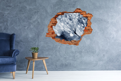 Sticker mural effet trou Des gouttes de rosée tombent sur un pissenlit