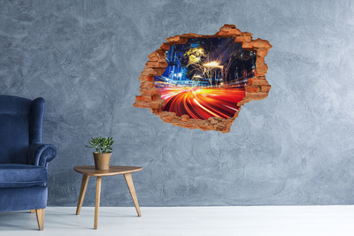 Sticker trou dans le mur Une ville en mouvement la nuit