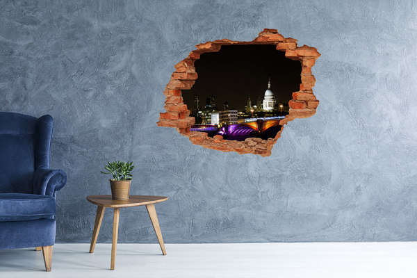 Sticker mural effet trou Vue nocturne de Londres à travers un trou dans le mur
