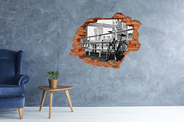 Sticker trou dans le mur Un vélo sur le quai de la ville