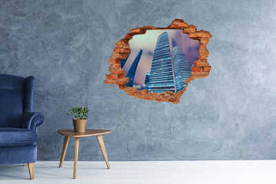 Autocollant mural trou Ville moderne à travers un trou dans le mur
