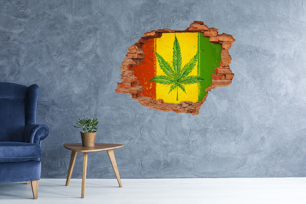 Sticker trou dans le mur Feuille de cannabis verte sur fond jaune-rouge-vert
