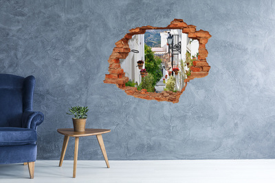 Sticker mural effet trou Une rue charmante dans un village blanc