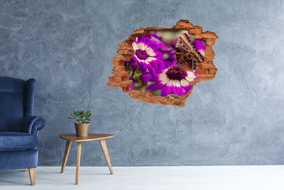 Sticker mural effet trou Papillon sur des fleurs dans un trou dans le mur