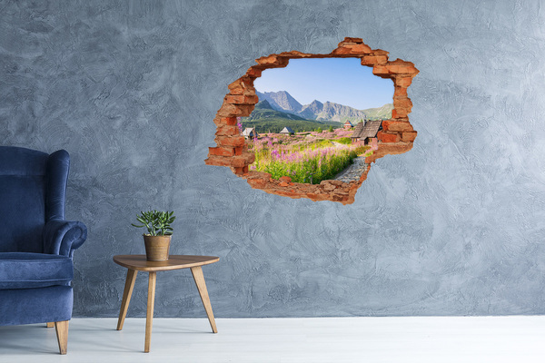 Sticker mural effet trou Une clairière de montagne en fleurs
