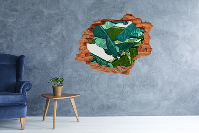 Sticker mural effet trou jardin tropical avec des feuilles de bananier