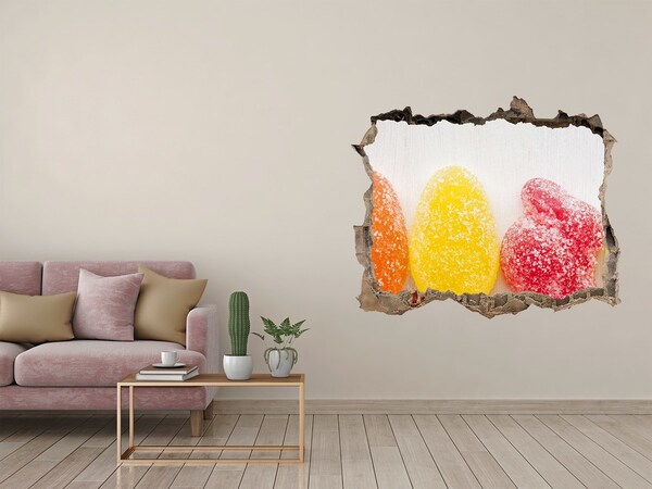 Sticker mural effet trou Des bonbons gélifiés dans un trou dans le mur