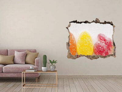 Sticker mural effet trou Des bonbons gélifiés dans un trou dans le mur
