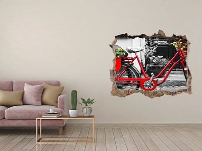 Sticker trou dans le mur Un vélo rouge dans un environnement urbain