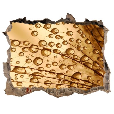 Autocollant à effet 3d trou Une goutte dorée sur fond de béton