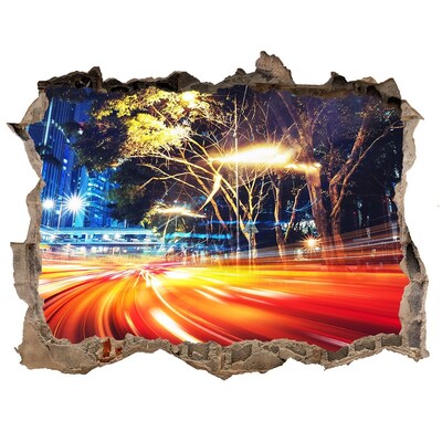 Sticker trou dans le mur Une ville en mouvement la nuit
