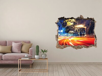 Sticker trou dans le mur Une ville en mouvement la nuit