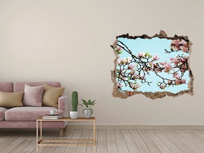 Sticker mural effet trou Des magnolias printaniers dans un ciel bleu