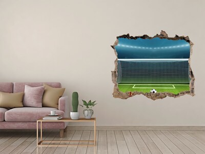 Autocollant mural trou Le stade de football derrière le trou dans le mur