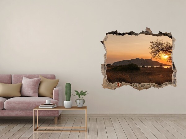 Autocollant mural trou Coucher de soleil sur un paysage montagneux