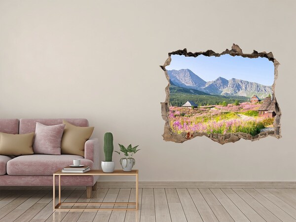 Sticker mural effet trou Une clairière de montagne en fleurs