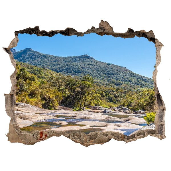 Autocollant mural trou Paysage montagneux derrière le trou dans le mur