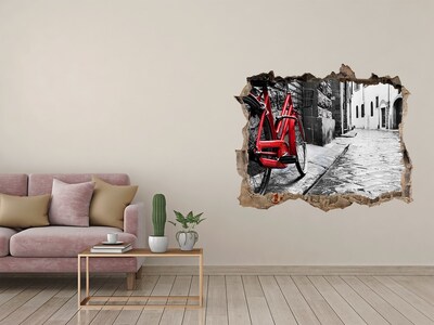Sticker trou dans le mur Un vélo rouge dans une rue charmante