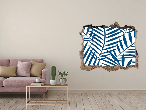 Sticker mural effet trou Des feuilles tropicales dans un trou dans le mur