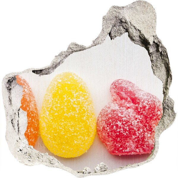 Sticker mural effet trou Des bonbons gélifiés dans un trou dans le mur