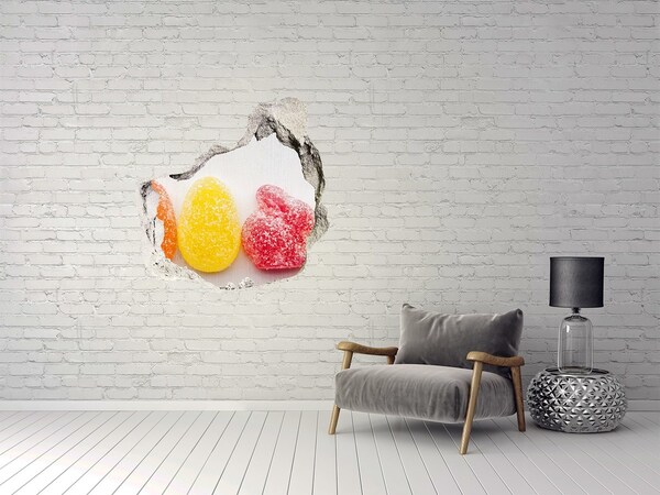 Sticker mural effet trou Des bonbons gélifiés dans un trou dans le mur