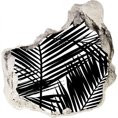 Sticker trou dans le mur Des feuilles tropicales dans un trou dans le mur