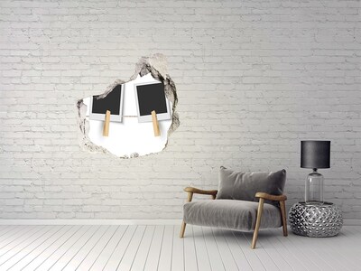 Autocollant mural trou Un mur abîmé avec des cadres photo